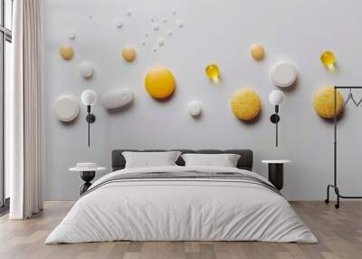 Different types of pills spread on a white surface Wall mural