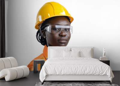 Ethnic female worker in safety attire and helmet gazing at camera isolated on white background Wall mural