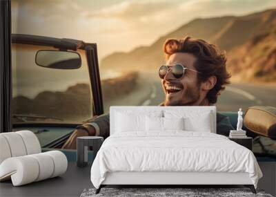 Man driving a high-end convertible along a scenic route, wind in his hair Wall mural