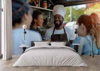 Multiracial people ordering food at counter in food truck outdoor - Soft focus on chef man face Wall mural