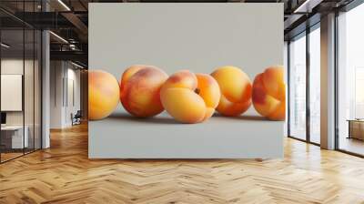 Several apricots with a soft focus on their surface details, positioned on a neutral background to emphasize their natural beauty and texture Wall mural