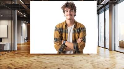 Smiling young man in casual attire, hands in pockets, isolated on white background Wall mural