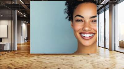 Sophisticated woman smiling against a light gradient background Wall mural