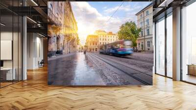 Blue tram rides on the morning  old european city.vintage picture Wall mural