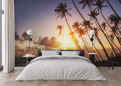 ocean beach on sunset with row palms on horizon Wall mural