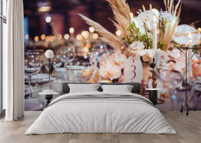 rustic wedding decorations with flowers and candles. banquet decor. picture with soft focus Wall mural