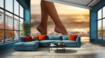 sexy woman's legs on the sandy beach with the sea water and su Wall mural