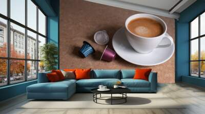 A white cup of hot coffee is prepared on the table - this is a wonderful invigorating drink for breakfast. aromatic fresh coffee in the morning. Wall mural