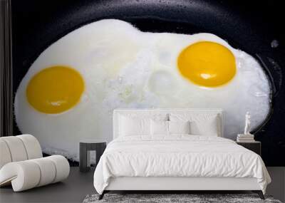 Scrambled eggs in oil in a frying pan Wall mural