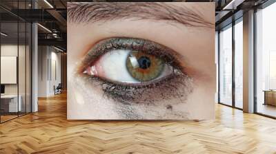 watery eye - sensitive eye of young girl - cying eye Wall mural