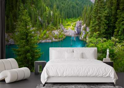 Lake Kaindy sunken forest in Kazakhstan. Beautiful mountain nature landscape. Blue lake Kolsai top view. Panoramic view of the nature reserve. Wall mural