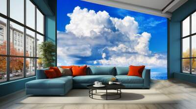 White cumulus clouds in blue sky over sea landscape, big cloud above ocean water panorama, horizon, beautiful tropical sunny summer day seascape panoramic view, cloudy weather, cloudscape, copy space Wall mural