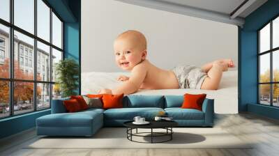 Portrait of a cute 3 months baby lying down on a blanket Wall mural