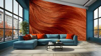 Red hair close-up as a background. Women's long orange hair. Beautifully styled wavy shiny curls. Hair coloring bright shades. Hairdressing procedures, extension. Wall mural