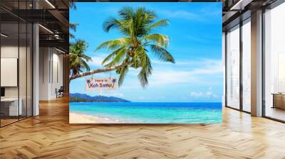 Here is Koh Samui - wooden sign on palm tree, paradise tropical island, sea sand beach landscape, ocean water, sun sky cloud, Surat Thani, Thailand, summer holidays, vacation, Southeast Asia travel Wall mural