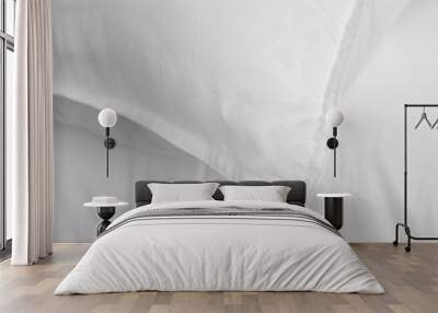 White soft pillow and bedsheet top view. White beddings. Wall mural