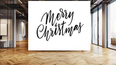 Merry Christmas lettering design. Seasonal greeting card template. A calligraphic hand written inscription Wall mural