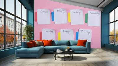 The days of the week - the paper stickers attached to the pink background Wall mural