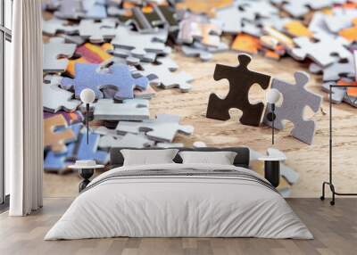 Black and Grey Jigsaw Puzzle Pieces on Table Wall mural