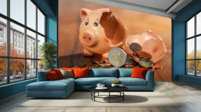 Broken piggy bank and euro coins Wall mural