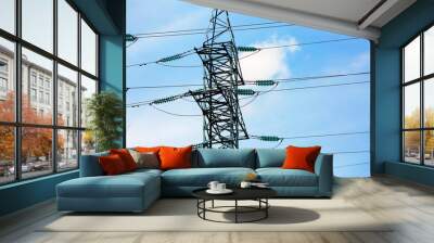 high voltage post. electricity transmission pylon silhouetted against blue sky. Wall mural