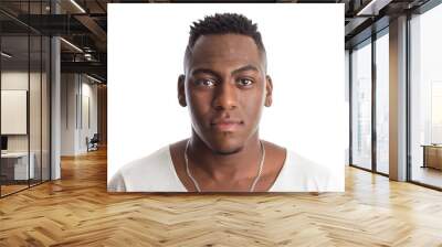 african american man looking confident at camera. Standing against white background. Wall mural