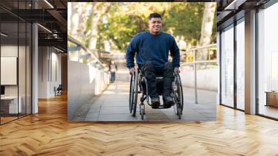 person in wheelchair finishing to climb access ramp. Wall mural