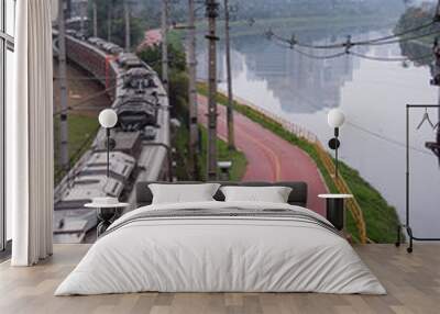 Train in transit. Sao Paulo city highway beside the river, bicycle lane. Skyline.. Wall mural