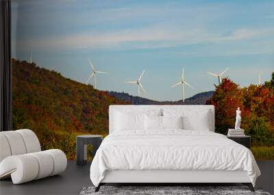 wind turbines along ridge line above  forest in autumn colors and field of golden corn ready for harvest 
 Wall mural