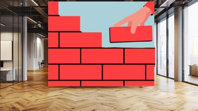 Vector illustration of unfinished brick wall. Bright illustration of a red brick wall construction with a hand putting a brick along with the rest. Wall mural