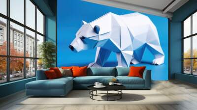 polar bear made of paper on a blue background. An origami figurine. Wall mural