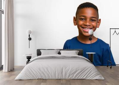 Portrait of a smiling African little boy in a blue t-shirt on transparent background. Front view, happy child in a blue shirt. Wall mural