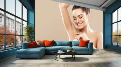 Beauty portrait. Armpit epilation, lacer hair removal. Young woman showing clean underarms. Wall mural