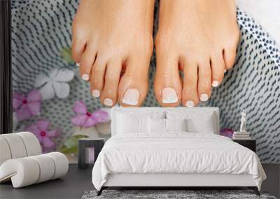 Well manicured and pedicured nails. Spa treatment and product for woman feet and foot spa. Wall mural