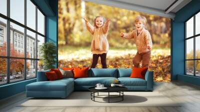 Funny twins in autumn park Wall mural