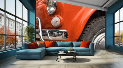 The unique details of exterior of the luxury retro car - oldtimer - the car headlights, shiny car hood and wing, the windshield and wheel Wall mural