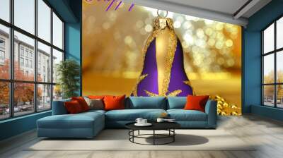 Christmas purple bell with beads around on golden light backgrou Wall mural