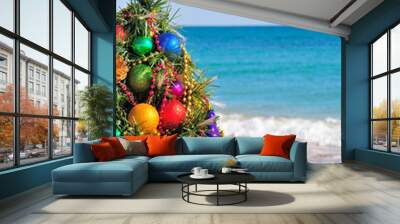 Christmas tree on the sand in the beach Wall mural