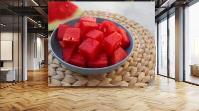 A bowl of fresh watermelon served on white bowl on wooden image. Breakfast fruit in the morning, healthy for the body. Wall mural