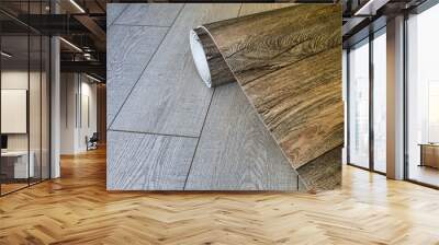 Roll of linoleum with a wood texture. Types of floor coverings.  Wall mural