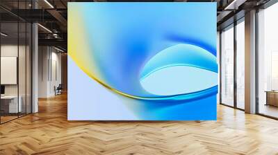 A smooth, flowing abstract design featuring blend of blue and yellow hues, creating serene and modern aesthetic. gentle curves evoke sense of calm and creativity Wall mural