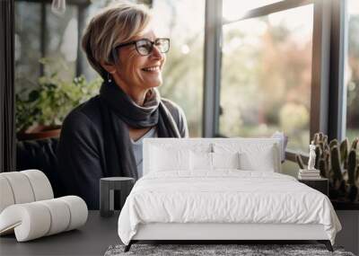 casual relax home lifestyle Portrait of a senior woman enjoying reading a book  on sofa in living room at home Wall mural