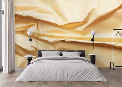 Crumpled golden fabric creates textured and elegant background, perfect for various design projects. warm hue adds touch of luxury and sophistication Wall mural