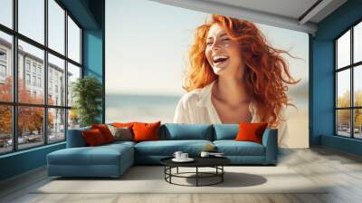 happiness joyful carefree leisure female woman red hair smiling relax enjoy summertime walking along the beach sunset vacation moment at the beach Wall mural