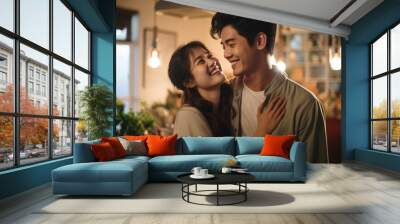 portrait of asian sweet marry love couple romantic hand hug hold embracing in living room at home family relation concept Wall mural