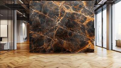 A close-up shot of a brown and gold marble surface, showing its intricate veining. Wall mural