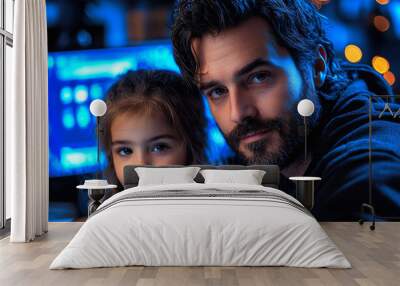 A father and daughter look at the camera, their faces illuminated by the blue glow of a computer screen. Wall mural