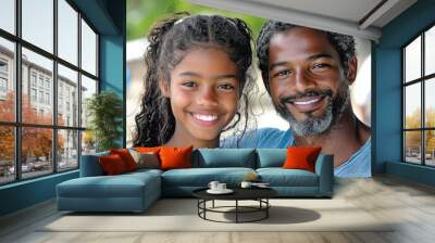 A father and daughter smile together on a beautiful day. Wall mural