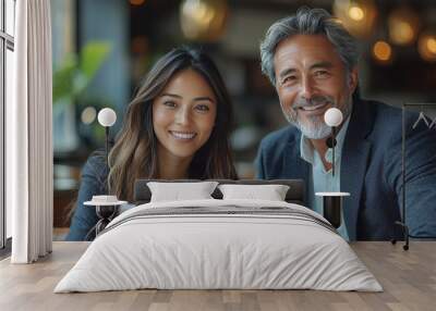 A young woman and an older man smile at the camera. Wall mural