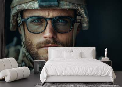 Close-up portrait of a soldier in uniform, looking intently at the camera. Wall mural